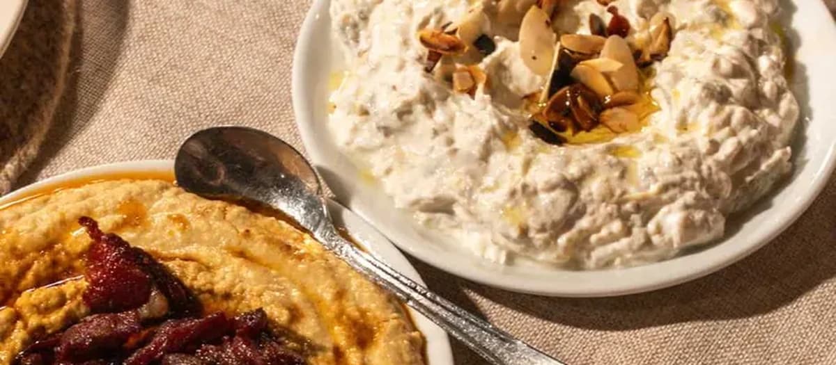 Three mezes: pastirma hummus, almond-topped haydari and olive-oil ezme